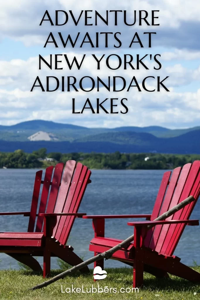 Red Adirondack chairs along the shore of Lake Champlain