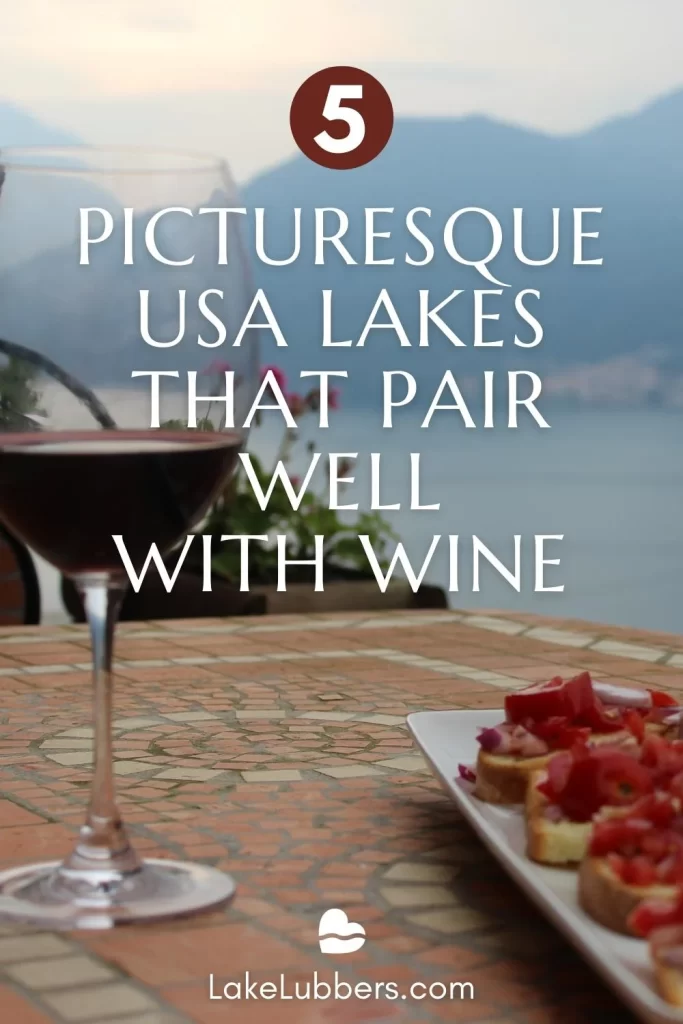 Red wine glass with lake in background