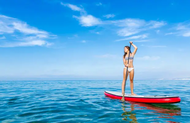 girl on a SUP on a lake