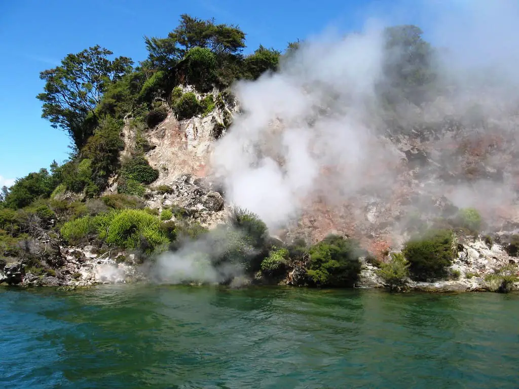 Steam rises off cliffs at Lake Rotomahana in New Zealand