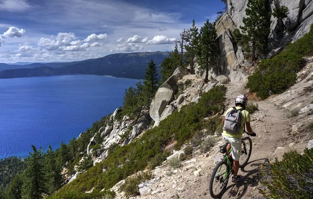 A cyclist traverses Flume Trail at Lake Tahoe