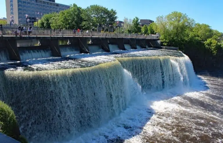 Water pours over the falls on the Rideau River in Ottawa, Ontario
