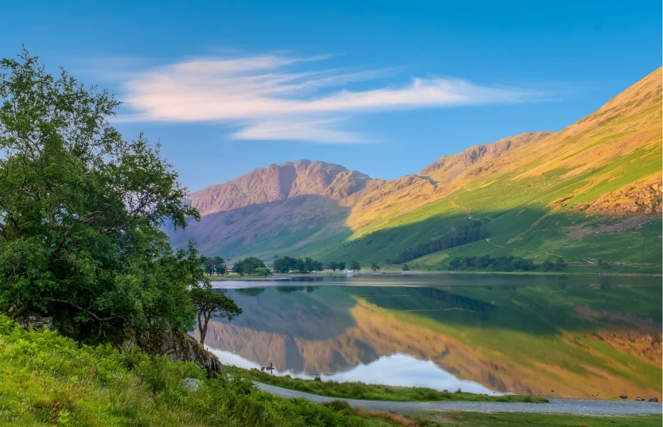 The sun rises along Buttermere in the English Lake District