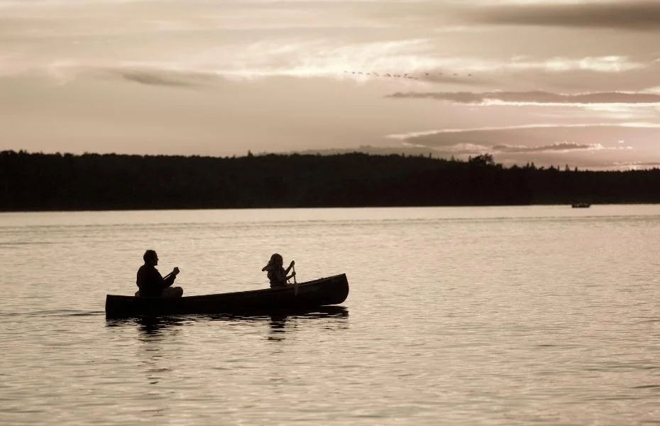 A couple canoes across Lake of the Woods