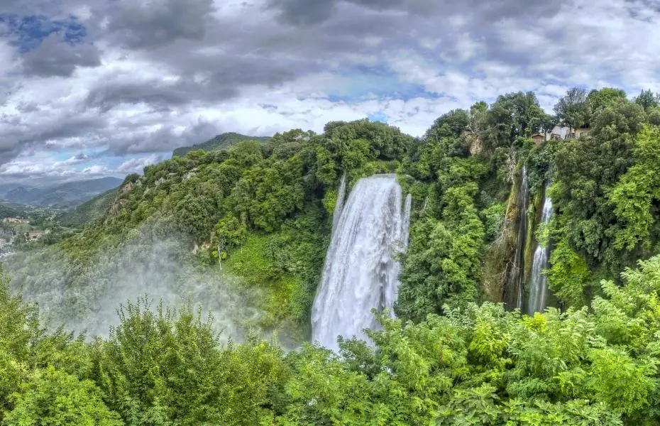 Lush foliage surrounds Marmore Falls in Italy